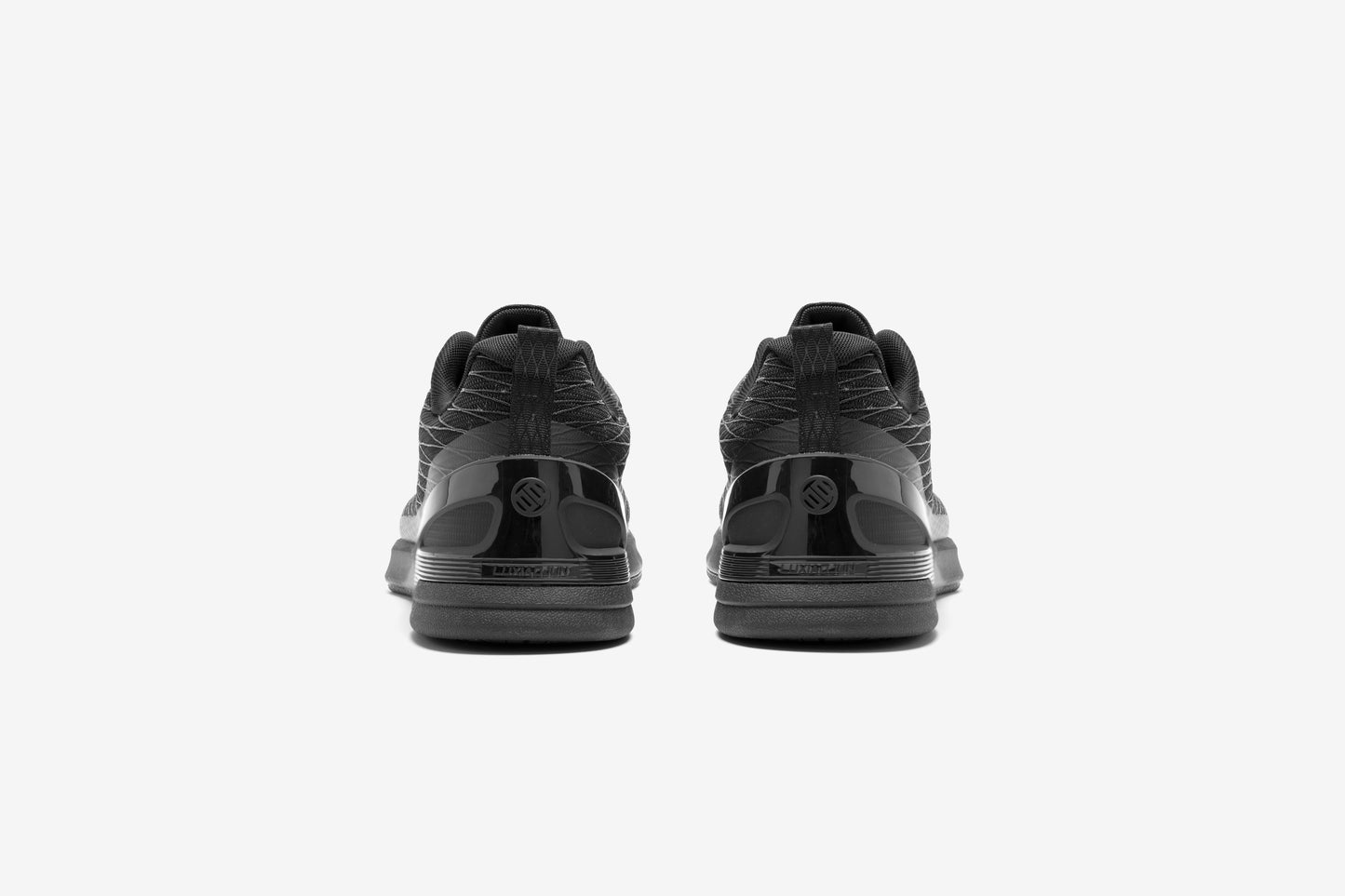black sneakers shoes for training workout with a brand logo 